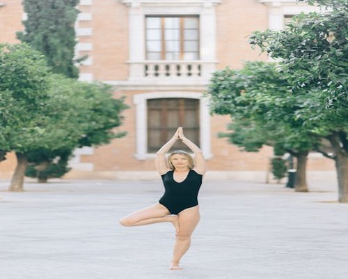 Person practicing yoga pose outdoors